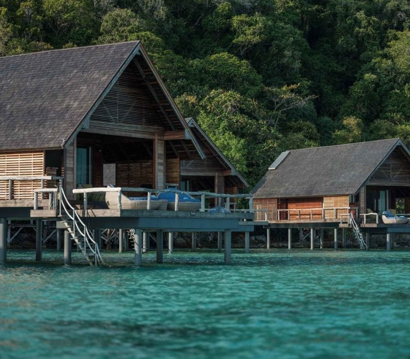 Beautiful Overwater Bungalows and crystal clear lagoons at Bawah Reserve, Indonesia