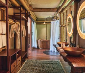 Copper bathtub and double sinks in the bathroom of the 2-bedroom pool villa at Bawah Reserve, Indonesia