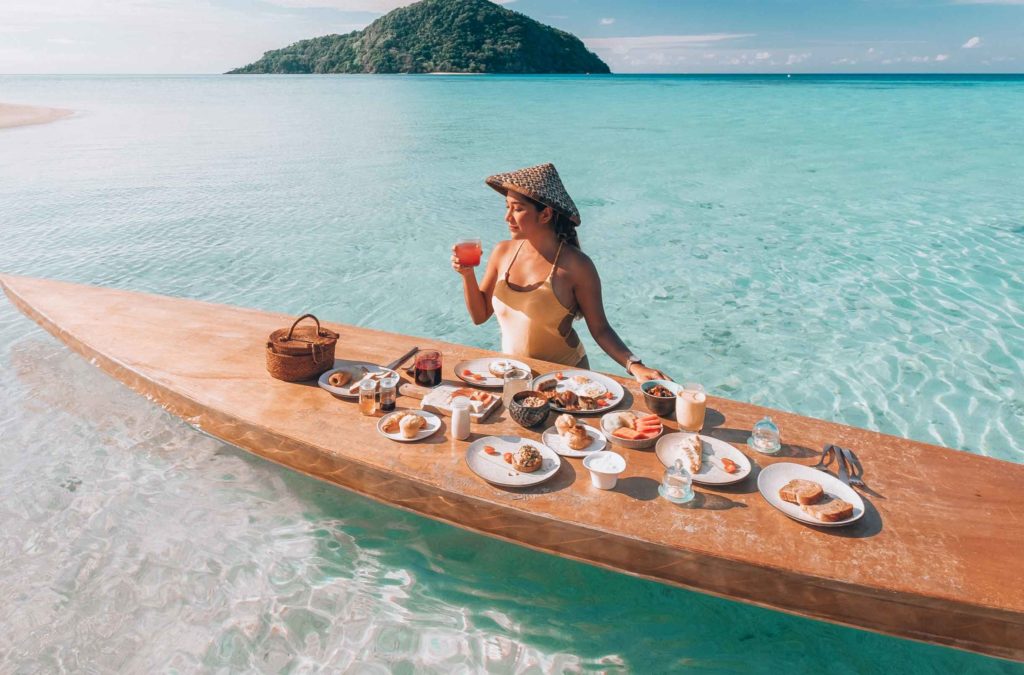Floating Breakfast on a stand up paddle board at Bawah Reserve, Indonesia