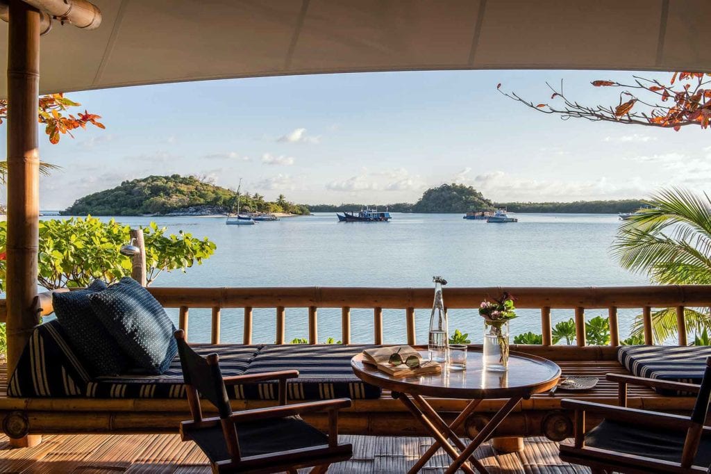 Beach Suite Verandah with a view of the boats in the lagoon at Bawah Reserve, Indonesia