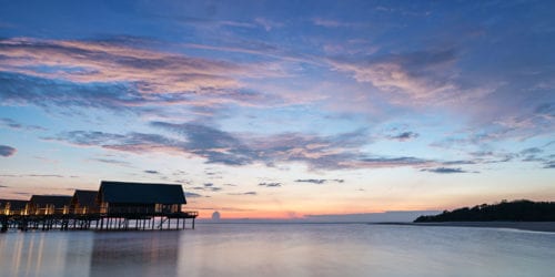 Honeymoon dream, Overwater bungalows at sunrise on Bawah Reserve, Indonesia