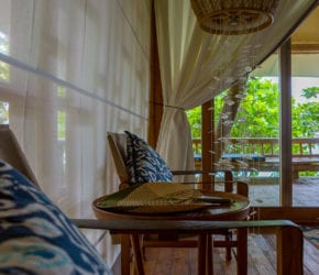 Garden suite bedroom with the signature jellyfish-shape chandeliers at Bawah Reserve, Indonesia