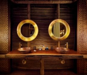 Luxury bathroom with copper mirrors in the garden suite at private island sustainable resort, Bawah Reserve, Indonesia