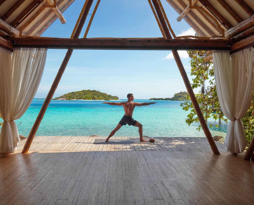 Yoga warrior pose at Bawah Reserve