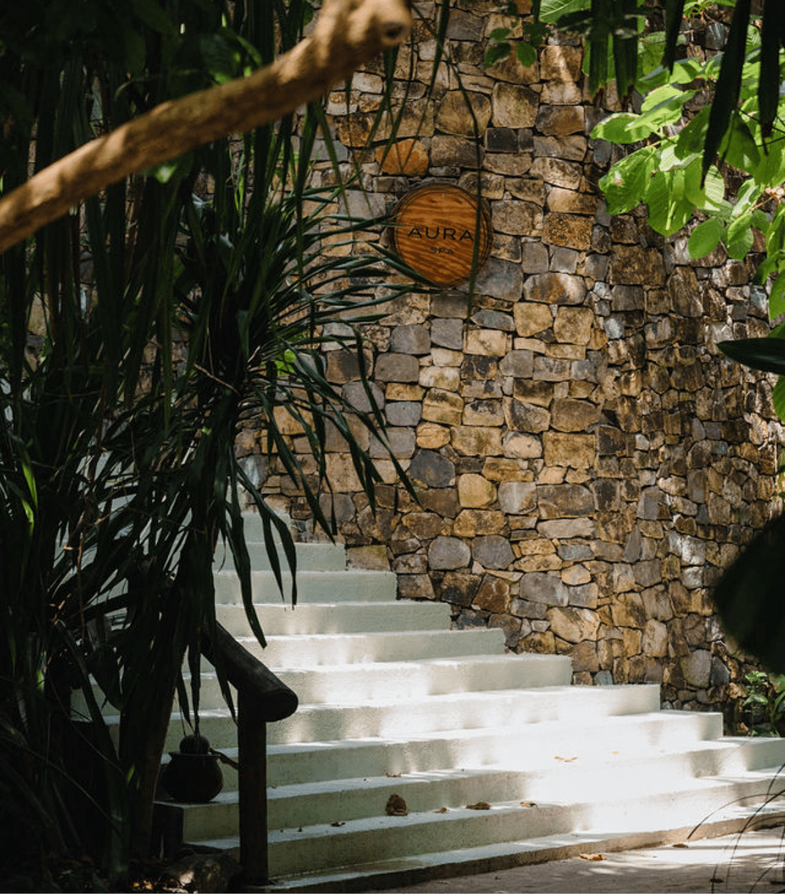 Aura Spa stairs with wooden aura sign
