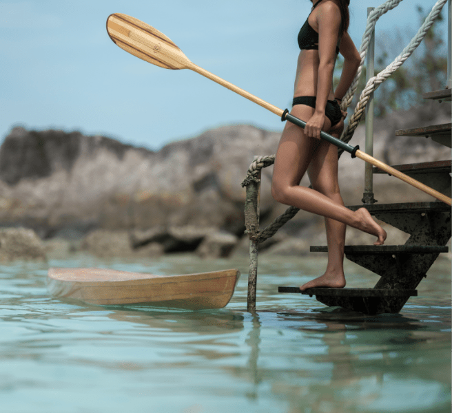 Activities at Bawah Reserve stand up paddleboarding from your suite.