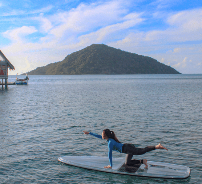 Activities at Bawah Reserve, Indonesia, SUP Yoga in lagoon