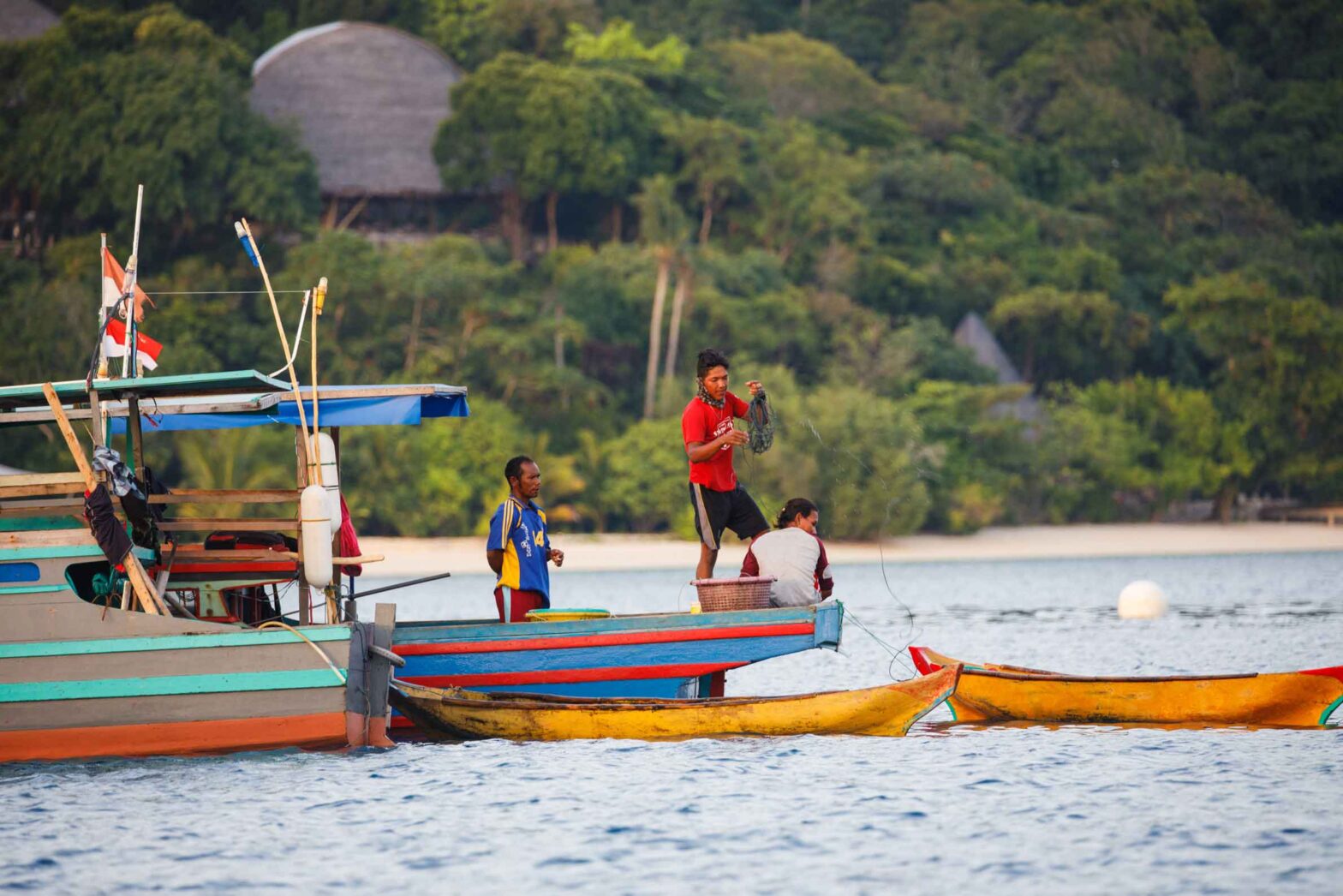 Local Indonesian fishermen taking harbour at Bawah Reserve.