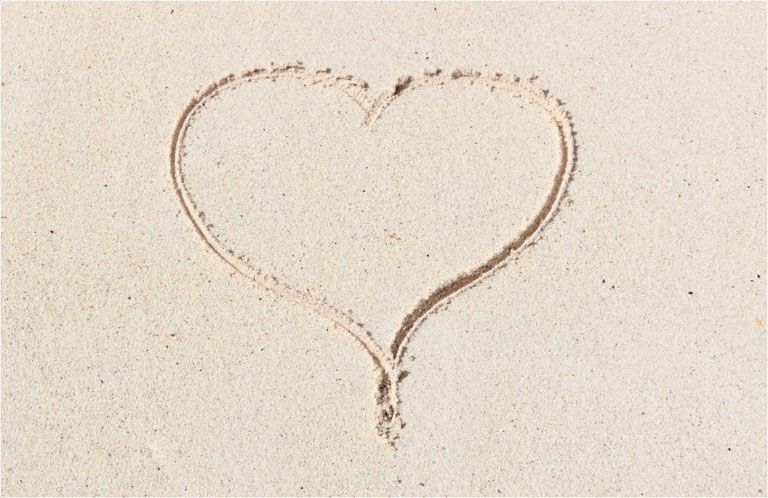 Will you marry me? Heart in the sand, Proposals on the beach at Bawah Reserve, Indonesia.